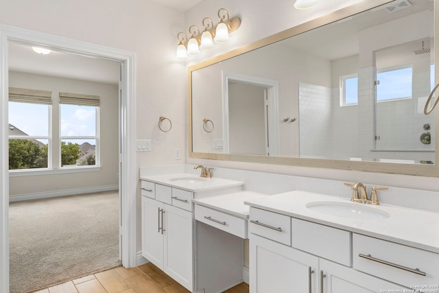 3082 Bright Skies, San Antonio, TX 78261 - bathroom with double vanity, tiled shower, and baseboards