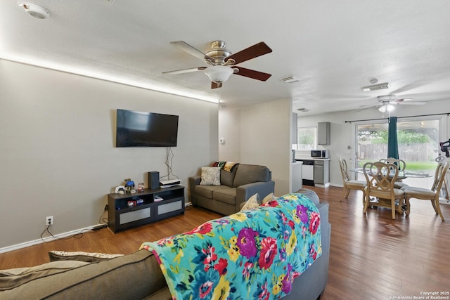 2435 Westgard, San Antonio, TX 78245 - living room featuring ceiling fan, wood finished floors, and baseboards