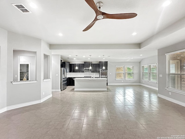 2826 Running Fawn, San Antonio, TX 78261 - unfurnished living room featuring ceiling fan, baseboards, a sink, recessed lighting, and light tile patterned flooring