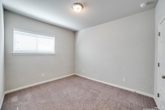 11741 Troubadour Trl, San Antonio, TX 78245 - carpeted empty room featuring baseboards and a smoke detector