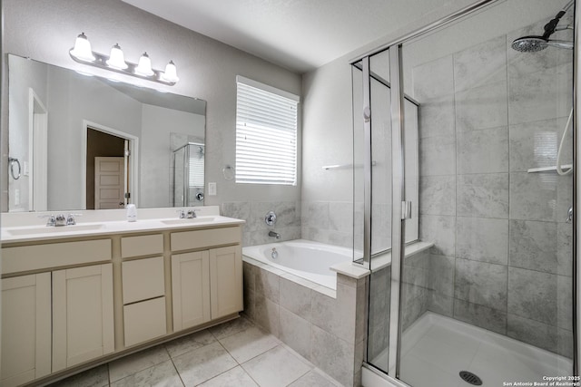 11741 Troubadour Trl, San Antonio, TX 78245 - full bathroom featuring a stall shower, a garden tub, double vanity, and tile patterned flooring