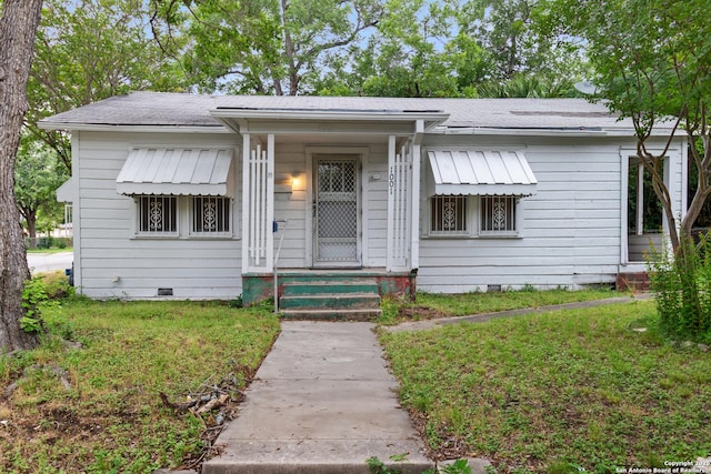 1001 Mason, San Antonio, TX 78208 - view of front of house with crawl space, a front yard, and a shingled roof