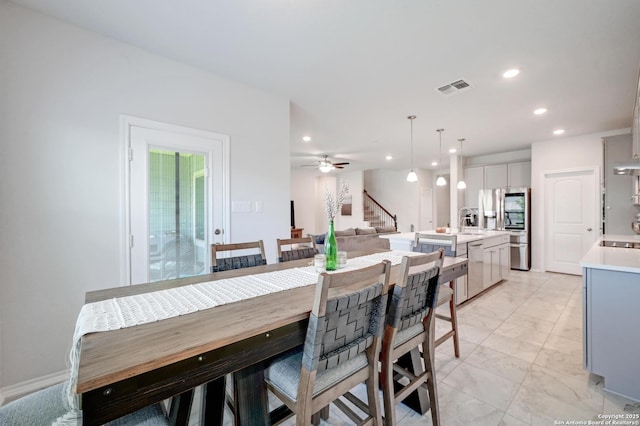 14468 Gecko Lndg, San Antonio, TX 78253 - dining area featuring recessed lighting, stairway, ceiling fan, and light marble finish flooring