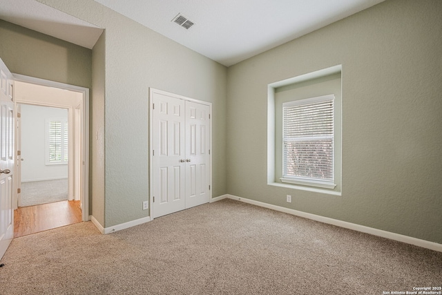 1210 Magellan, Windcrest, TX 78239 - unfurnished bedroom featuring carpet floors, a closet, and baseboards