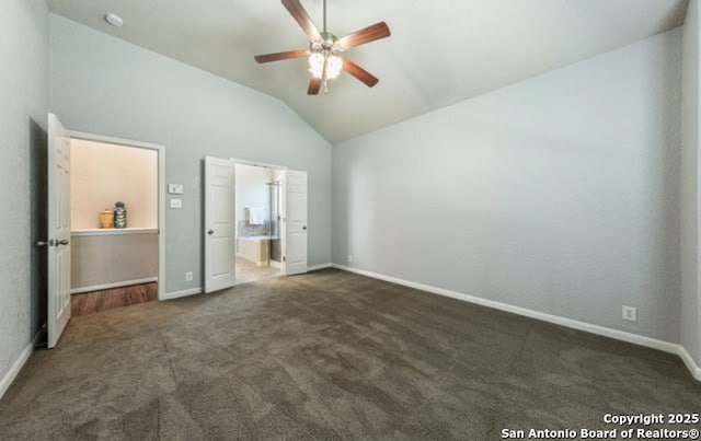 1210 Magellan, Windcrest, TX 78239 - unfurnished bedroom with lofted ceiling, dark carpet, baseboards, and connected bathroom
