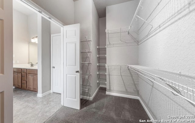 1210 Magellan, Windcrest, TX 78239 - walk in closet with light tile patterned floors
