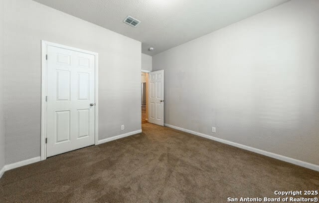 1210 Magellan, Windcrest, TX 78239 - unfurnished bedroom featuring carpet and baseboards