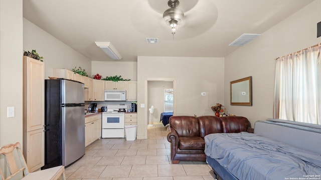 160 E Klein, New Braunfels, TX 78130 - bedroom with freestanding refrigerator and light tile patterned flooring