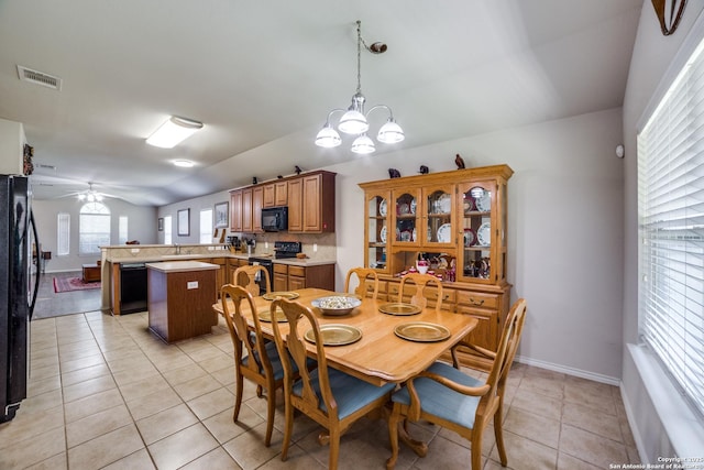 703 Point Spgs, San Antonio, TX 78253 - dining room featuring ceiling fan, light tile patterned flooring, vaulted ceiling, and a chandelier