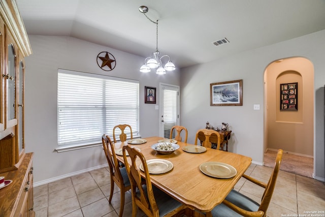 703 Point Spgs, San Antonio, TX 78253 - dining room featuring light tile patterned floors, healthy amount of natural light, lofted ceiling, arched walkways, and baseboards