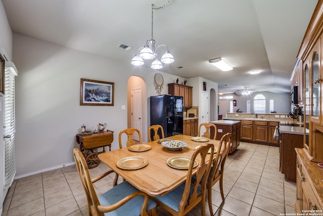 703 Point Spgs, San Antonio, TX 78253 - dining area with arched walkways, light tile patterned floors, a ceiling fan, a chandelier, and baseboards