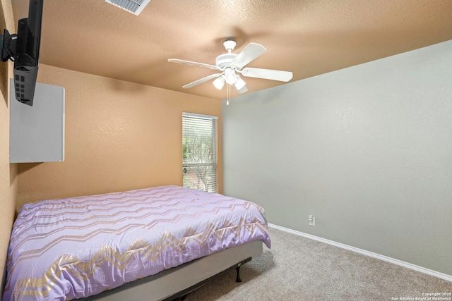 4222 Manitou Bay, San Antonio, TX 78259 - carpeted bedroom featuring baseboards, ceiling fan, and a textured ceiling