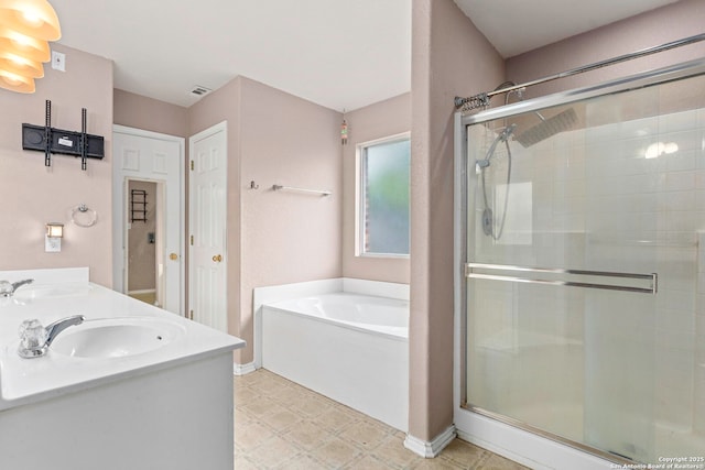4222 Manitou Bay, San Antonio, TX 78259 - bathroom featuring a stall shower, a garden tub, tile patterned floors, and double vanity