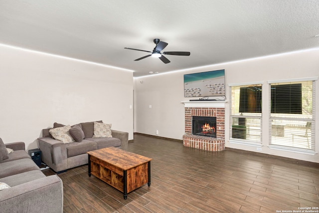 4222 Manitou Bay, San Antonio, TX 78259 - living area featuring ceiling fan, wood finished floors, a fireplace, and baseboards