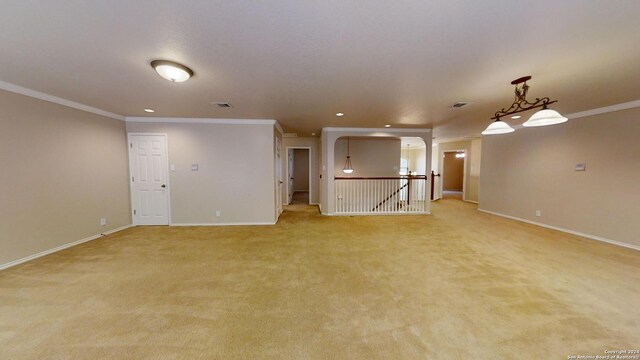 545 Triple Crown, Schertz, TX 78108 - unfurnished living room featuring crown molding, baseboards, light colored carpet, recessed lighting, and arched walkways