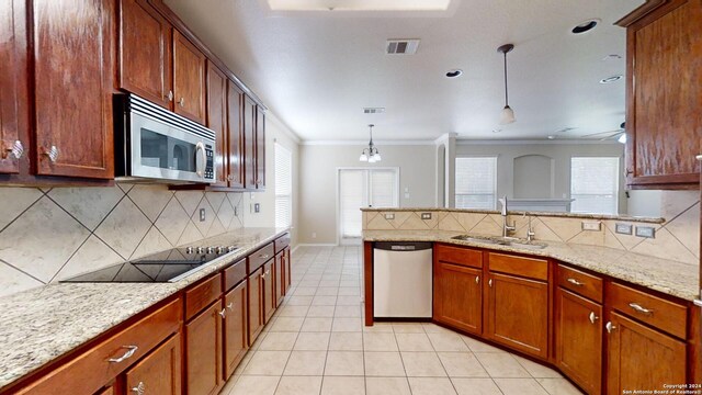 545 Triple Crown, Schertz, TX 78108 - kitchen with stainless steel appliances, a sink, a peninsula, light tile patterned flooring, and backsplash
