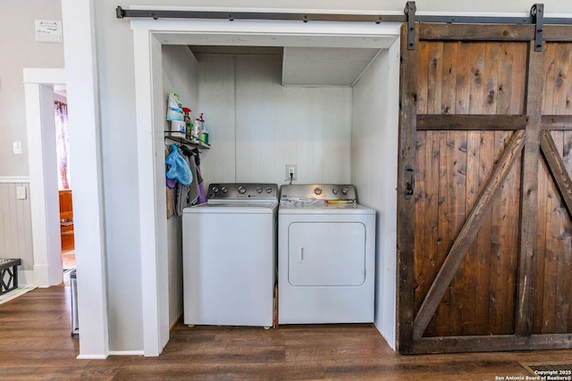 225 W Humphreys, Seguin, TX 78155 - laundry room with independent washer and dryer, dark wood-style flooring, and a barn door