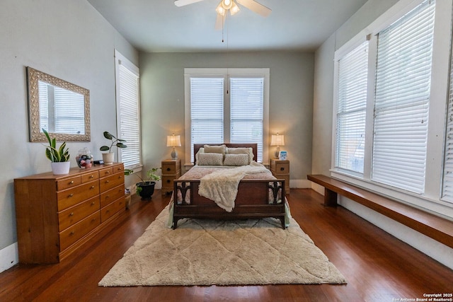 225 W Humphreys, Seguin, TX 78155 - bedroom with dark wood-type flooring, baseboards, and a ceiling fan
