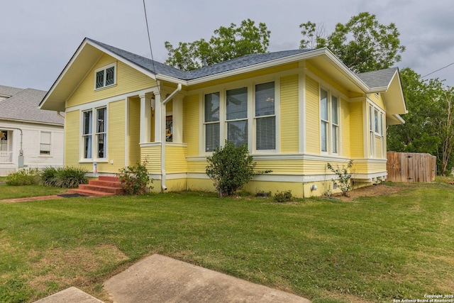 225 W Humphreys, Seguin, TX 78155 - view of front of house featuring a front lawn and roof with shingles