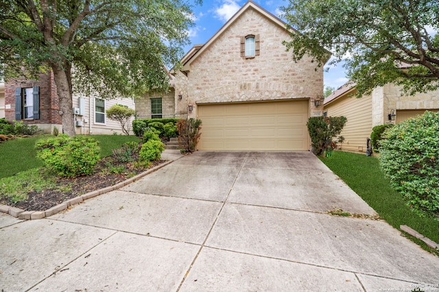 7459 Eagle Ledge, San Antonio, TX 78249 - view of front of property with concrete driveway, a front yard, and stone siding