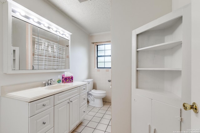 118 Elkins, San Antonio, TX 78226 - bathroom featuring a textured ceiling, tile patterned flooring, toilet, vanity, and crown molding