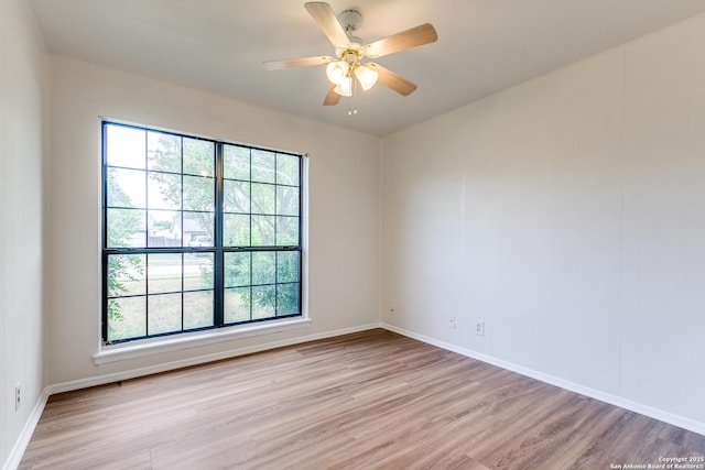 118 Elkins, San Antonio, TX 78226 - empty room featuring light wood-style floors, baseboards, and ceiling fan