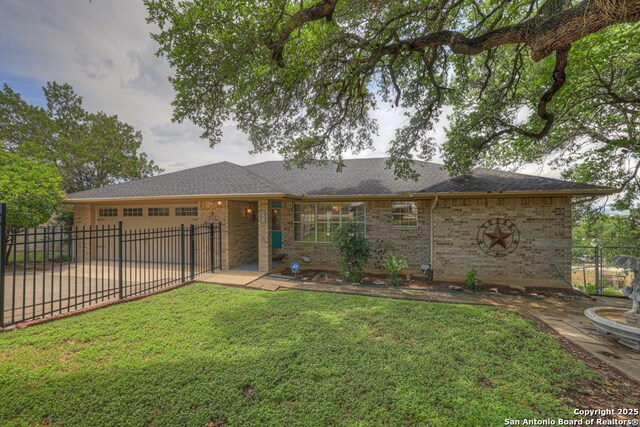 821 Lakeview, Canyon Lake, TX 78133 - ranch-style home with a garage, brick siding, and driveway