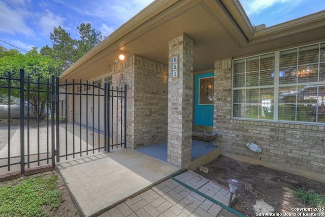 821 Lakeview, Canyon Lake, TX 78133 - property entrance featuring a gate and brick siding