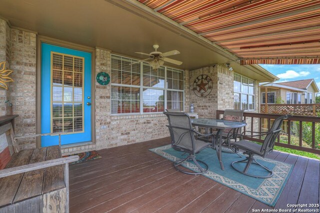 821 Lakeview, Canyon Lake, TX 78133 - wooden deck with outdoor dining space and a ceiling fan