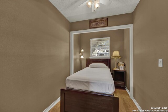 821 Lakeview, Canyon Lake, TX 78133 - bedroom featuring light wood-style floors, baseboards, and ceiling fan
