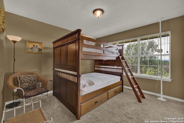821 Lakeview, Canyon Lake, TX 78133 - bedroom with light colored carpet, baseboards, and a textured ceiling