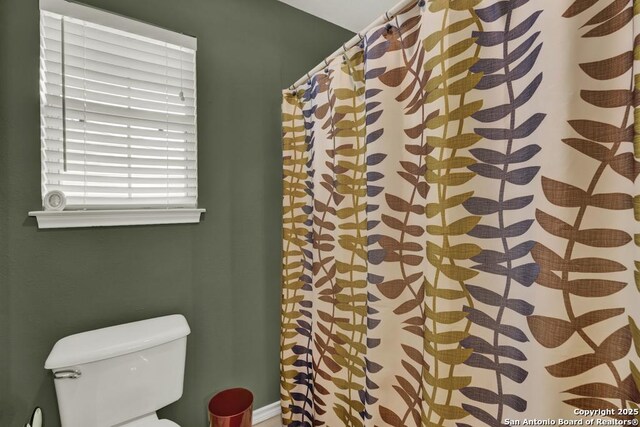 821 Lakeview, Canyon Lake, TX 78133 - bathroom with toilet and curtained shower