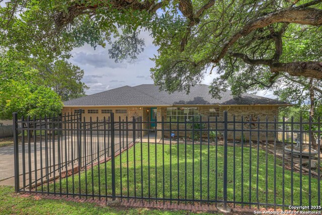 821 Lakeview, Canyon Lake, TX 78133 - back of house with brick siding and roof with shingles