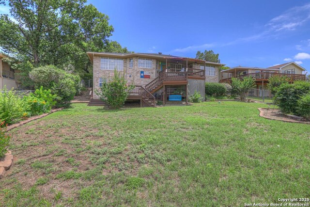 821 Lakeview, Canyon Lake, TX 78133 - rear view of house featuring stairway and a wooden deck