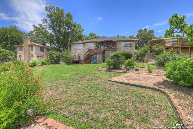 821 Lakeview, Canyon Lake, TX 78133 - view of yard with stairs, a wooden deck, and a patio area