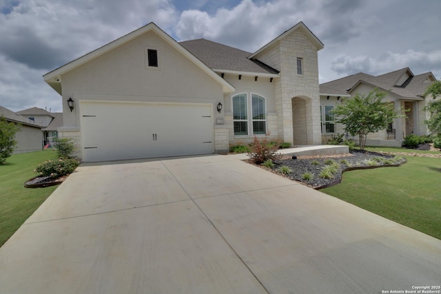128 Maravillas, Boerne, TX 78006 - view of front facade with stone siding, a front yard, a garage, and concrete driveway