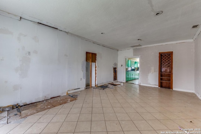 3311 W Commerce St, San Antonio, TX 78228 - unfurnished room featuring crown molding, baseboards, and a textured ceiling