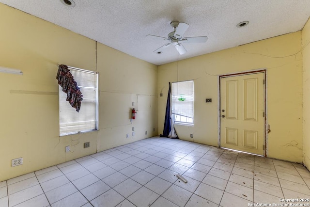 3311 W Commerce St, San Antonio, TX 78228 - entrance foyer with ceiling fan, a textured ceiling, and light tile patterned flooring