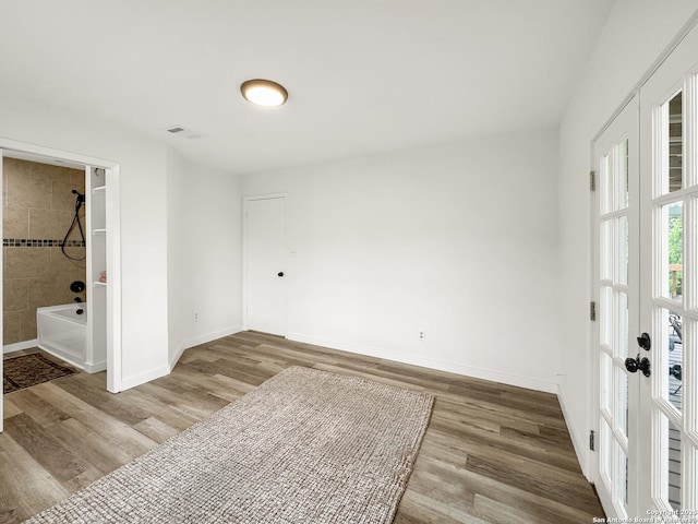 1412 Laurie, Canyon Lake, TX 78133 - empty room with wood finished floors, baseboards, and french doors