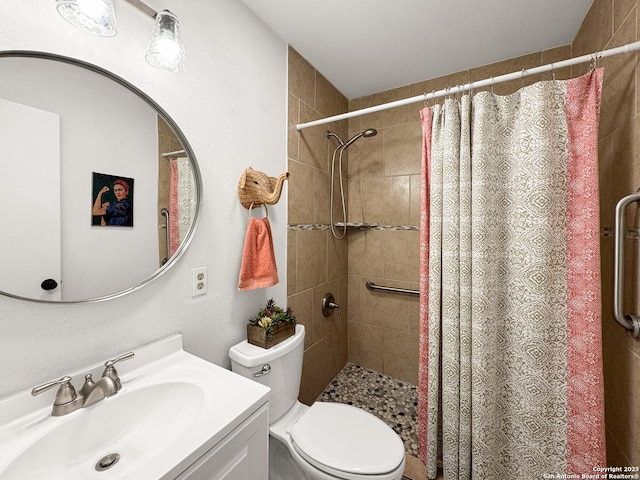 1412 Laurie, Canyon Lake, TX 78133 - bathroom with toilet, tiled shower, and vanity