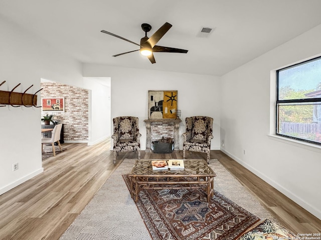 1412 Laurie, Canyon Lake, TX 78133 - sitting room with a ceiling fan, wood finished floors, and baseboards