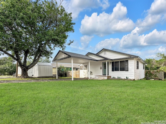 1412 Laurie, Canyon Lake, TX 78133 - ranch-style house with a front yard and an attached carport