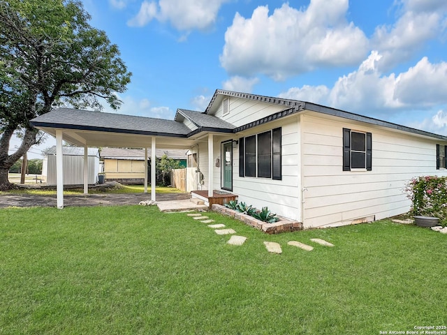 1412 Laurie, Canyon Lake, TX 78133 - view of front facade featuring a front lawn and an attached carport