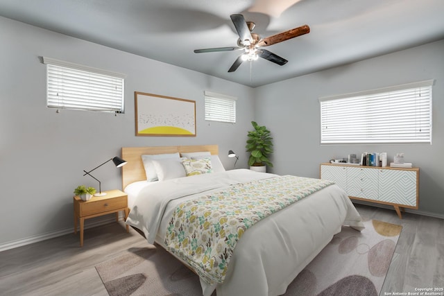 10442 Macarthur, Converse, TX 78109 - bedroom with light wood-style floors, baseboards, and ceiling fan