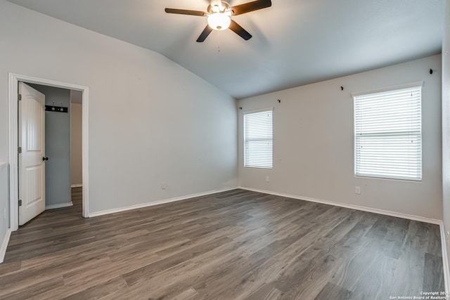 10442 Macarthur, Converse, TX 78109 - empty room with vaulted ceiling, ceiling fan, dark wood finished floors, and baseboards