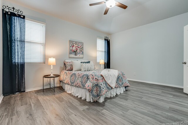10442 Macarthur, Converse, TX 78109 - bedroom with wood finished floors, baseboards, and ceiling fan