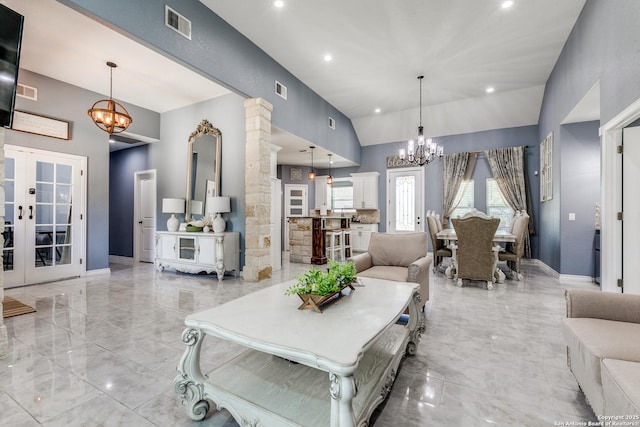 5722 Pioneer Rdg, San Antonio, TX 78245 - living area with a chandelier, light marble finish flooring, decorative columns, vaulted ceiling, and french doors