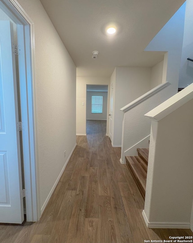 15302 Smoky Honeyeater, San Antonio, TX 78253 - hallway featuring wood finished floors, baseboards, and stairs