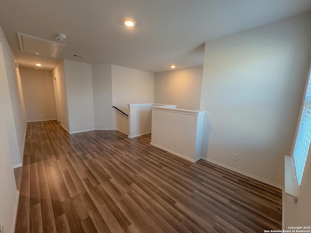 15302 Smoky Honeyeater, San Antonio, TX 78253 - unfurnished room featuring attic access, wood finished floors, baseboards, and recessed lighting