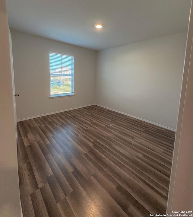 15302 Smoky Honeyeater, San Antonio, TX 78253 - empty room with dark wood-style flooring, baseboards, and recessed lighting